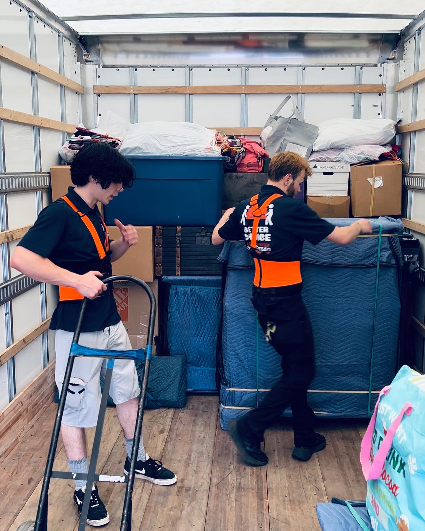 Better Choice Moving crew loading a truck with wrapped furniture