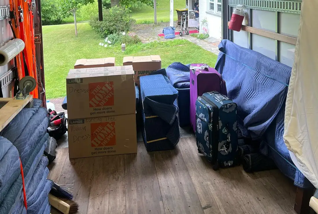 Boxes, luggage and wrapped furniture loaded in a Better Choice Moving truck on a Perkasie, PA move